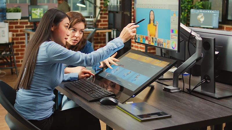 Two designers working together on website design